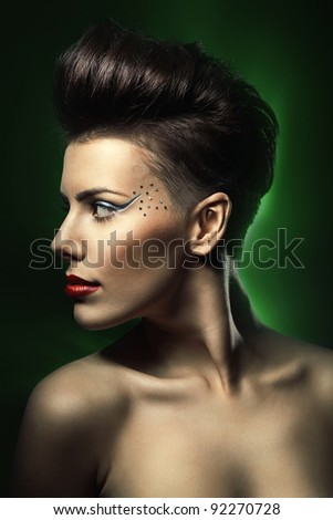 woman with red lips in dark green light