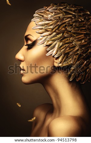 beautiful woman with gold feather hat
