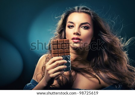 sexy beautiful woman with chocolate and wind