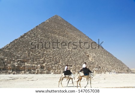 GIZA, EGYPT - MAY 31:Egyptian tourist polices on camel guards the Pyramid of Khufu in Giza, Egypt on May 31, 2011.Since the 90\'s tourist became a target by Muslim militant in Egypt.