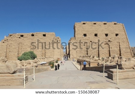 LUXOR, KARNAK, EGYPT - JUNE 19: Tourists going to the temples of Karnak complex on June 19, 2011. in Luxor, Egypt. Tourism is an important item in the Egyptian economy.