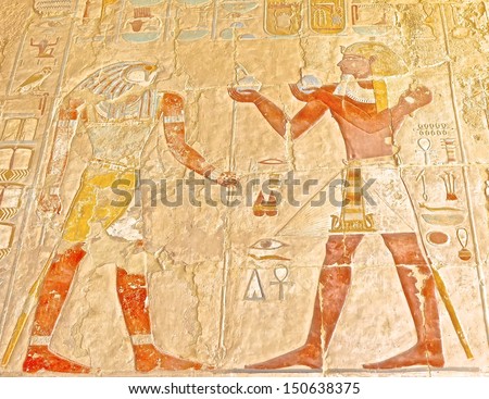 LUXOR, EGYPT-JUN 18: Polychromed carvings of the Pharaoh and God Horus at the awesome Temple of Queen Hatshepsut, between the Valley of Kings and the Valley of Queens, in Luxor, 2011,Egypt.