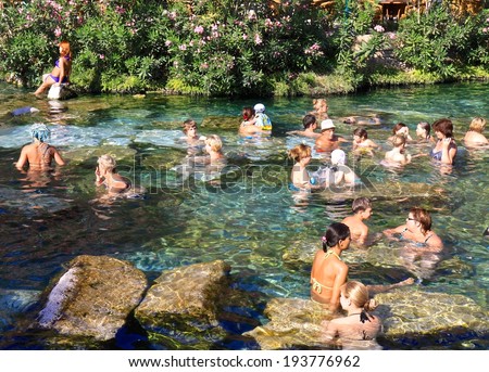 PAMUKKALE, TURKEY - JULY 1:People enjoy hot spring spa in antique pool at Pamukkale,July 1, 2009. pamukkale, meaning \