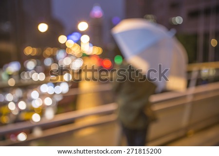Blurred city lights and bokeh building in the rainy day.