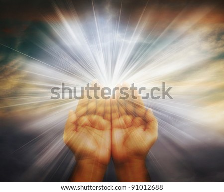 Prayer raised hands on cloudy background Prayer raised hands on cloudy background