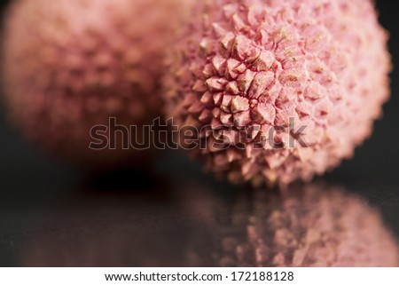 Litchi fruit with black background