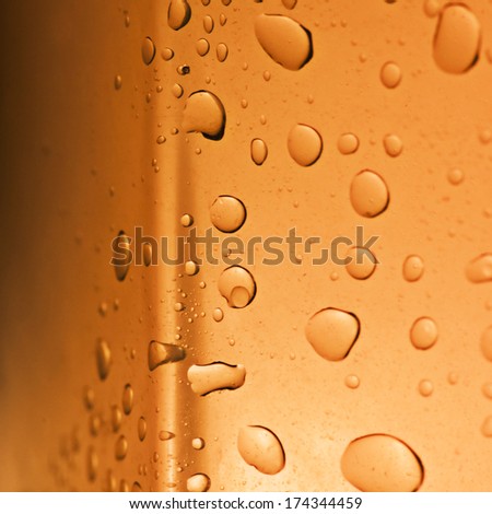 Fresh background of water drops on orange surface