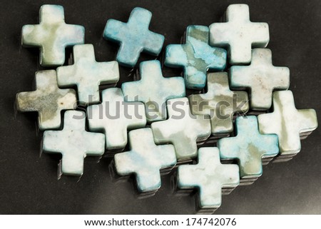Cross shaped agate with dark background