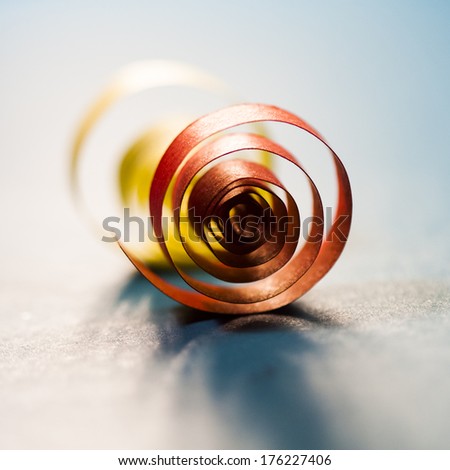 Macro, abstract, background picture of colored paper spirals on paper background