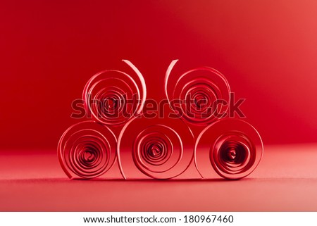 Macro, abstract, background picture of red paper spirals on paper background