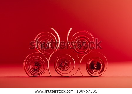 Macro, abstract, background picture of red paper spirals on paper background
