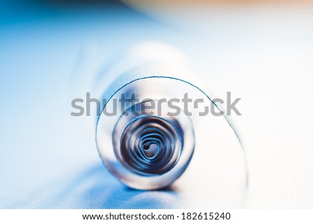 Macro, abstract, background picture of blue paper spirals on paper background
