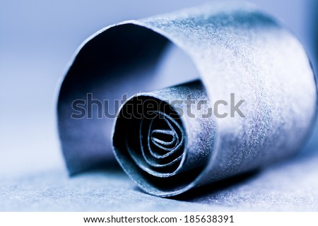 Dark blue abstract, background picture of a paper spiral on paper background