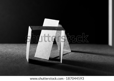 Black paper shapes and shadows with paper background