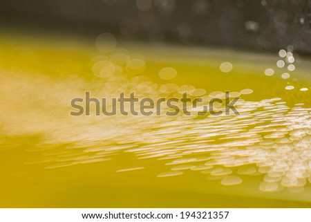 Abstract, blurred, colorful composition with oil, water, ink, bubbles and bokeh