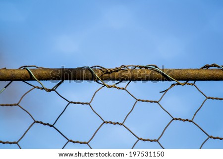 Woven rusty wire fence - texture