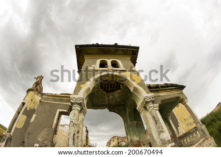 Parts of a ruined house with dramatic sky - different textures and herbs. Fisheye lens effect