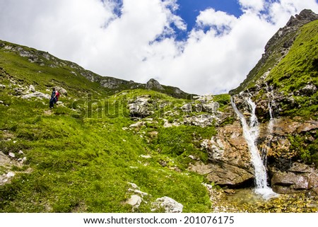 Landscape with waterfall from Bucegi Mountains, part of Southern Carpathians in Romania