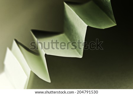 Colorful paper shapes with paper background