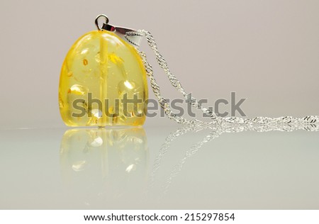 Silver jewels with colorful precious stones and light grey background