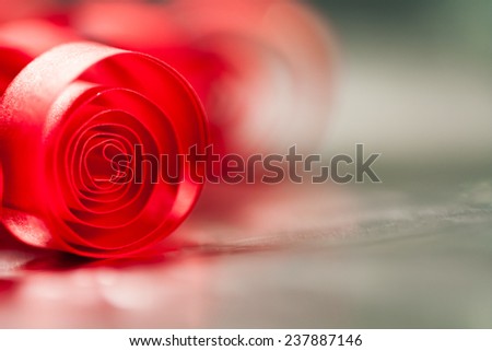 Macro, abstract, background picture of red paper spirals with reflections