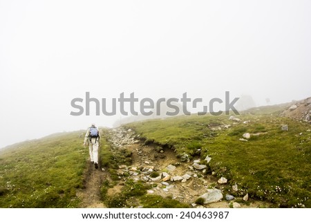 Landscape from Bucegi Mountains, part of Southern Carpathians in Romania in a very foggy day