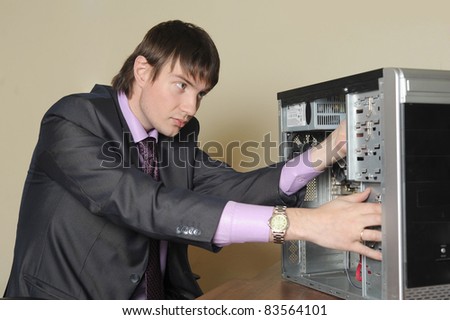 Expert in information technologies repairing the computer