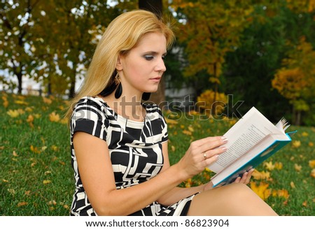Girl with book in the park
