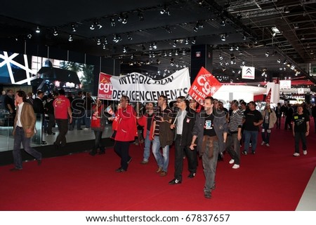PARIS - OCTOBER 12: Workers from the french union CGT disrupt the 2010 Paris Motor Show on October 12, 2010 in Paris