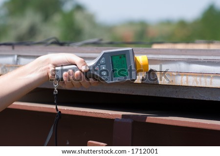 Man holding a Geiger Counter