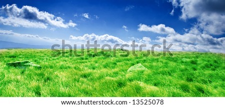 Rolling grass hills under a dreamy sky