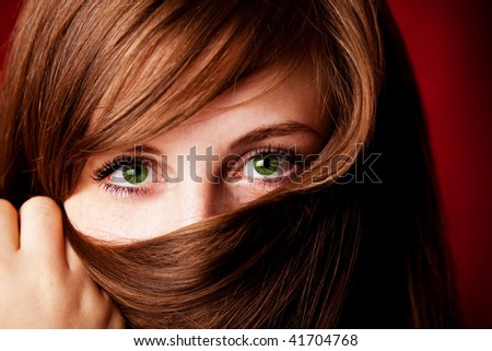 Close-up portrait of beautiful green-eyed girl