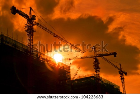 back light construction site silhouetted at sunset