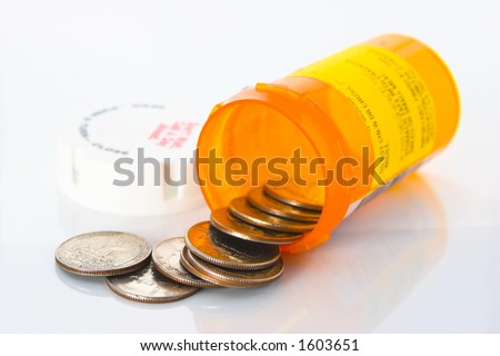 Quarters spilling out of a prescription pill bottle. Illustrating the high cost of health care.