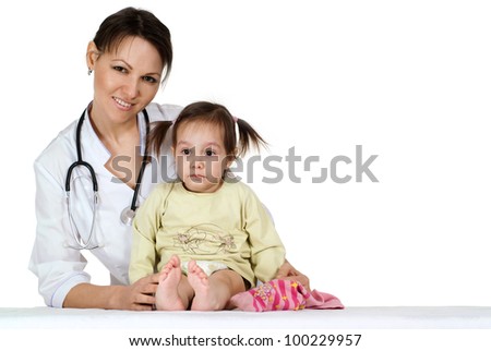 Beautiful nice nurse with a girl sitting on a table on a white background