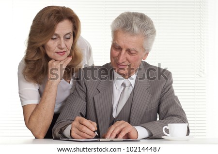 a nice old man with a lady on a light background