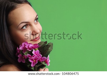 Luck Caucasian young woman with flowers in the background