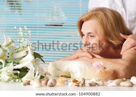 Beautiful Caucasian elderly woman at a reception in the spa salon