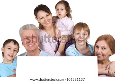 Happy Caucasian family of six people holding the paper on a white background
