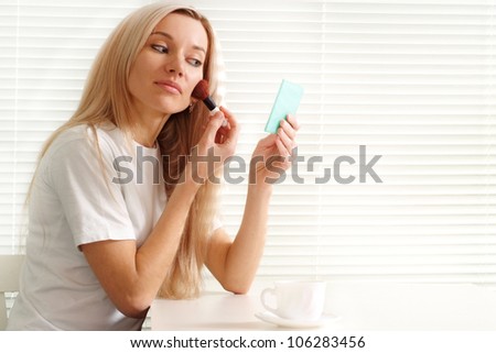 Luck Caucasian woman sitting paint on a light background