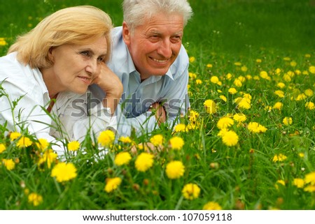 Mature couple enjoy union with nature, fresh air and stunning views