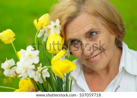 Mature lady enjoys union with nature, fresh air and stunning views