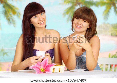 Beautiful girls are resting at a resort near the sea