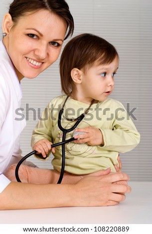 portrait of a cute doctor with little girl