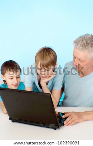 Two generations of people on a blue background
