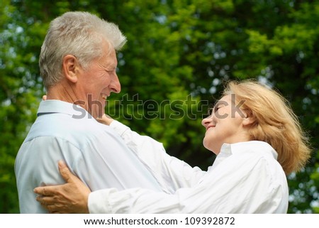 Mature couple enjoy union with nature, fresh air and stunning views
