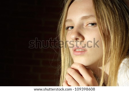 Nice blonde with a bright appearance on dark background
