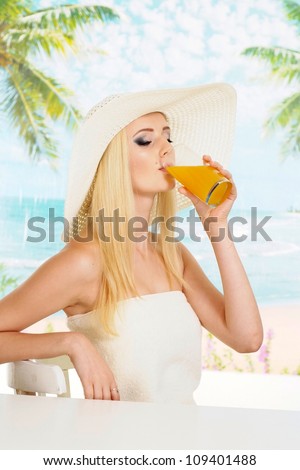 Sympothetic blonde with a bright appearance is resting at a resort