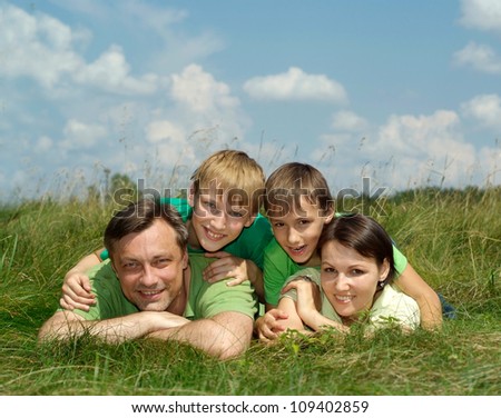 Good family having fun in the company of each other on the nature