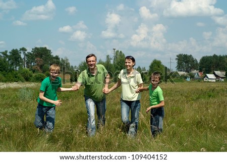 Nice family having fun in the company of each other on the nature